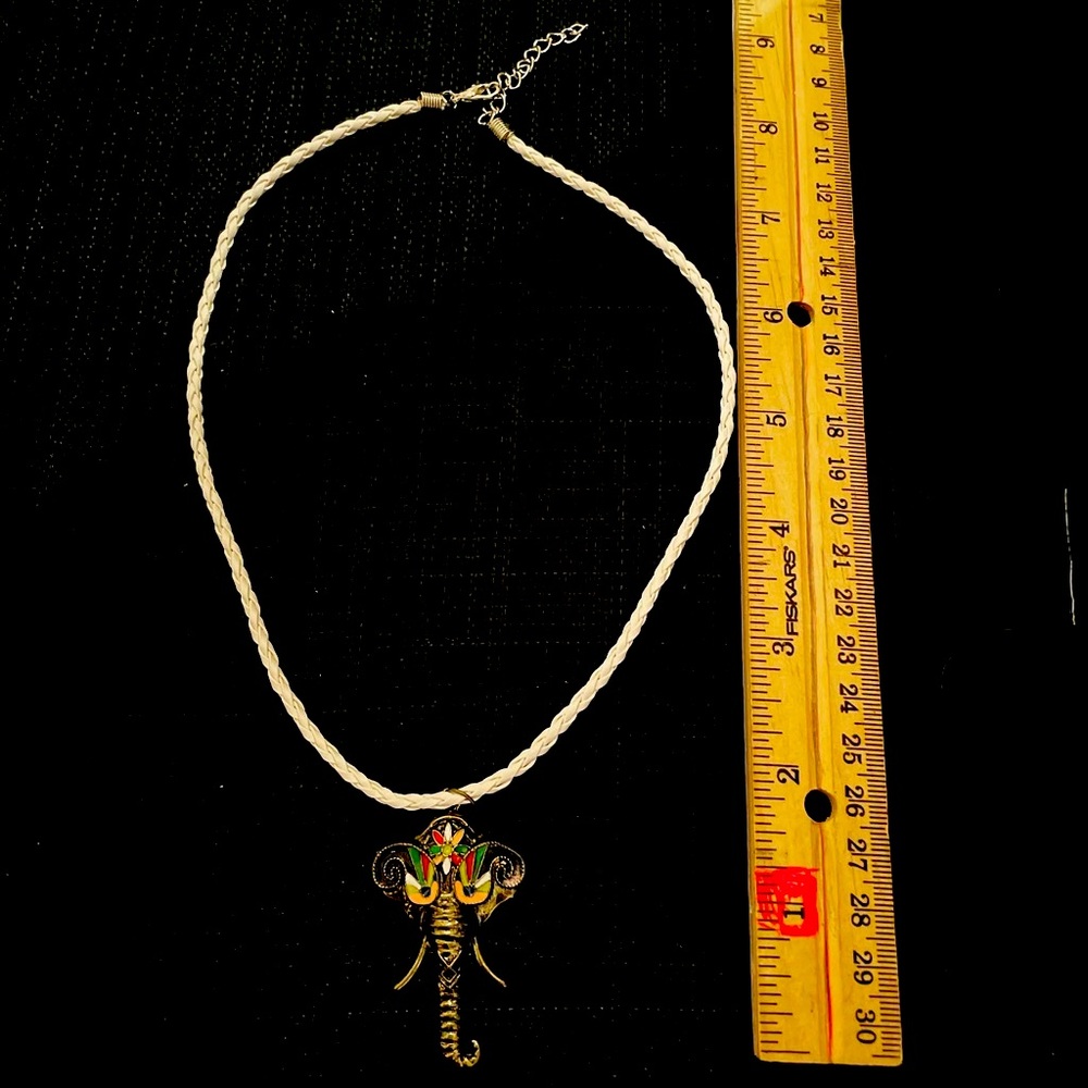 Multi colored elephant pendant on faux leather